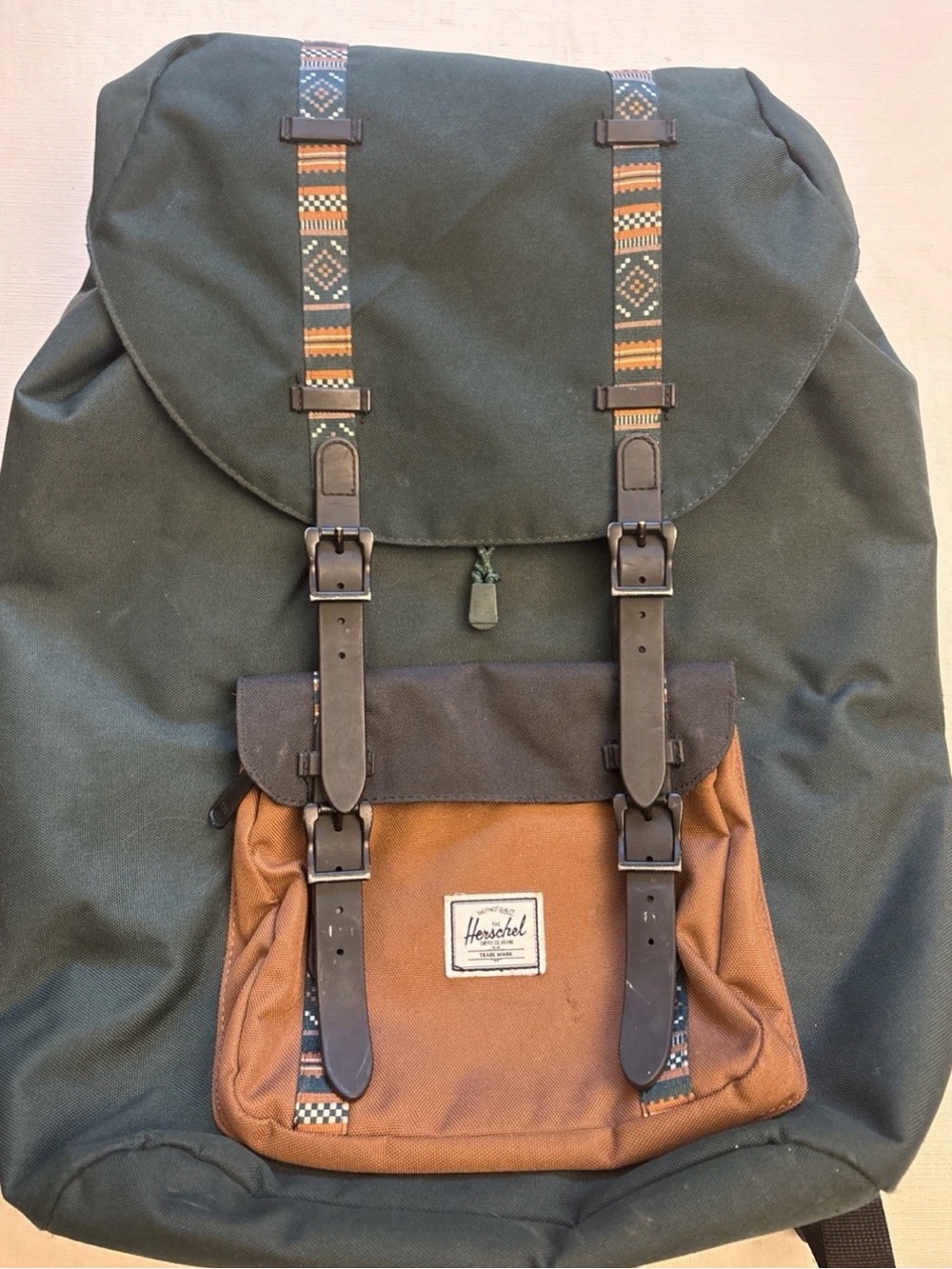 Herschel Supply Company dark green and brown backpack with patterned straps
